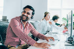Photo of a smiling support engineer with a headset 